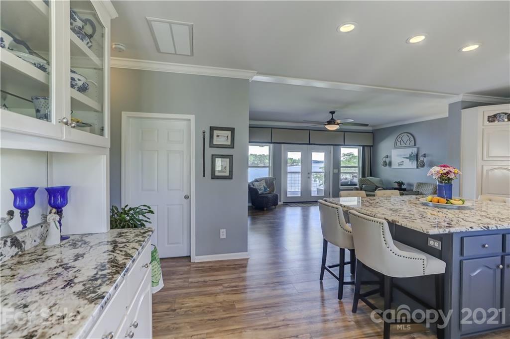 437 State Rd S-20-457 Ridgeway, SC 29130 - Photo 14 of 48 a dining hall with stainless steel appliances granite countertop wooden floor a dining table and chairs