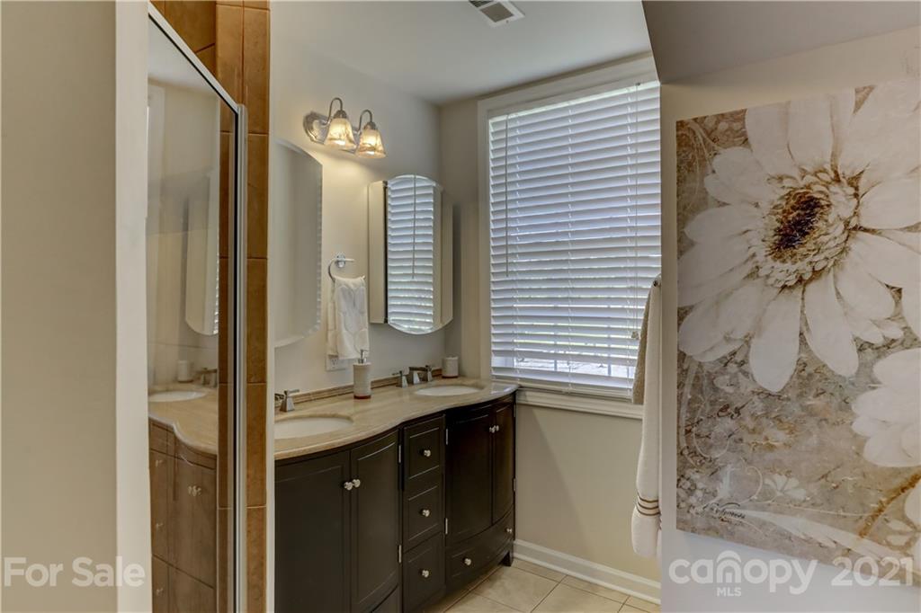 437 State Rd S-20-457 Ridgeway, SC 29130 - Photo 33 of 48 a bathroom with a double vanity sink mirror and shower