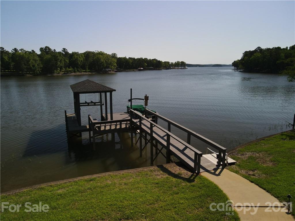 437 State Rd S-20-457 Ridgeway, SC 29130 - Photo 7 of 48 a view of a lake with a bench next to a lake