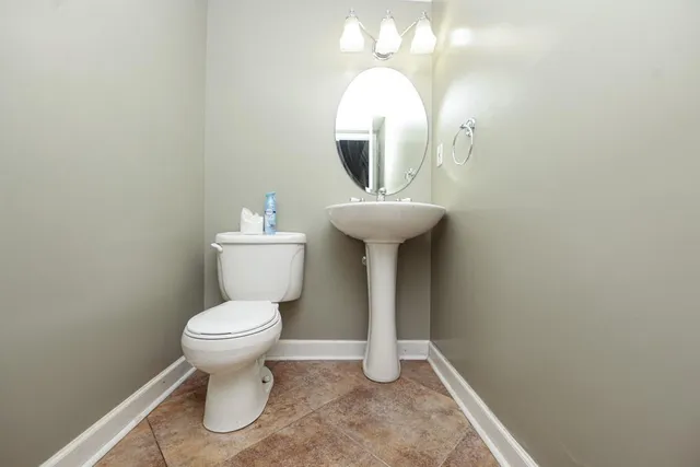 an empty room with a fan and a fan