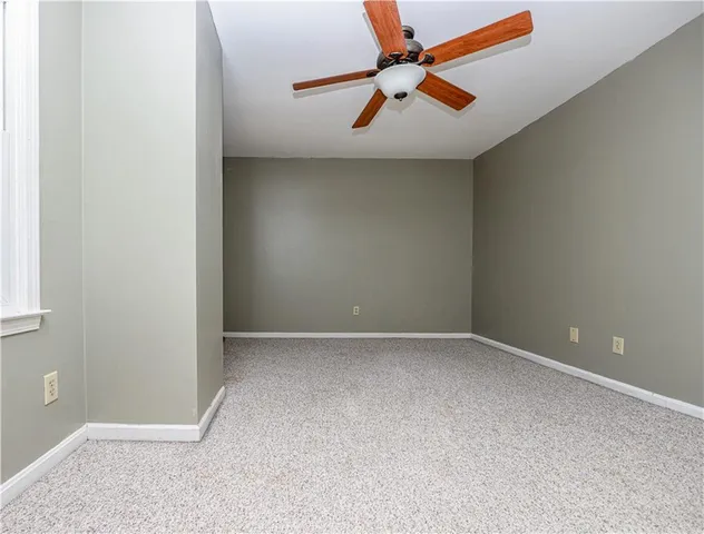 a bathroom with a toilet a sink and a window