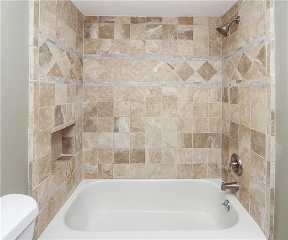 an empty room with closet area