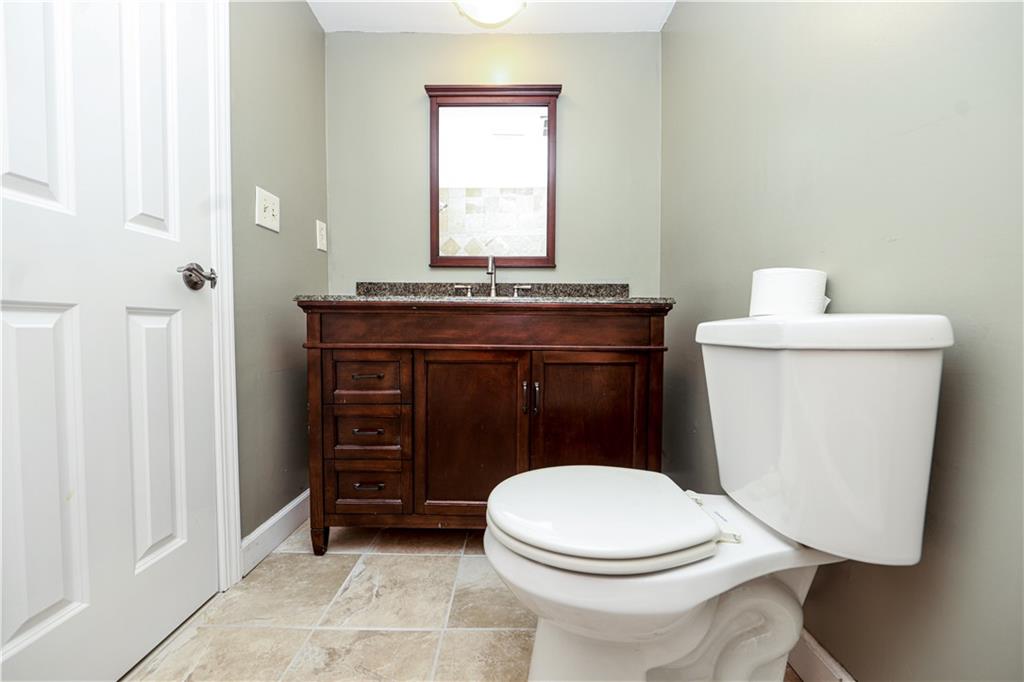 1101 Scott Boulevard Decatur, GA 30030 - Photo 20 of 27 a bathroom with a toilet a sink and a window