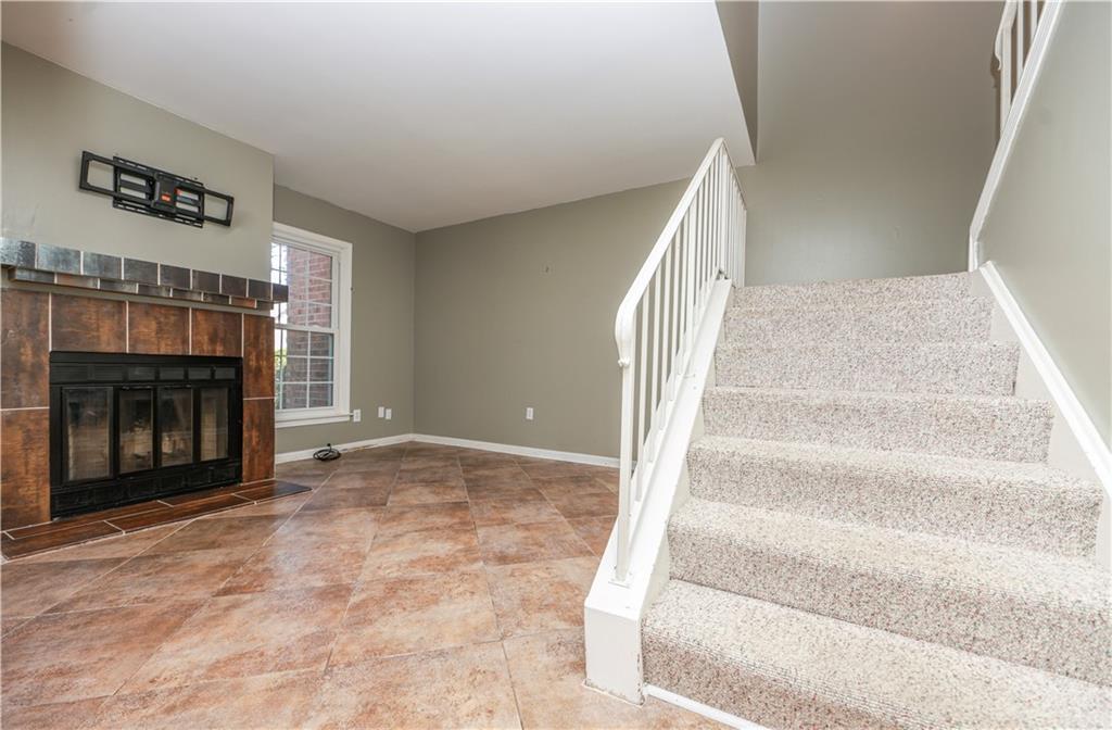 1101 Scott Boulevard Decatur, GA 30030 - Photo 8 of 27 a view of an empty room with wooden floor and fireplace