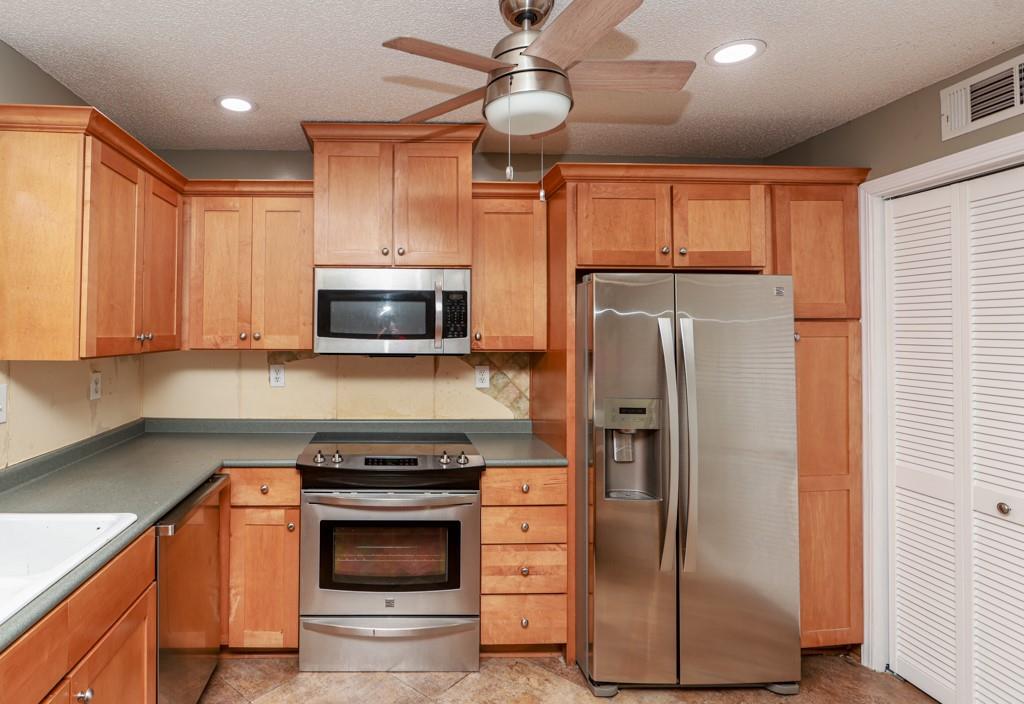 1101 Scott Boulevard Decatur, GA 30030 - Photo 10 of 27 a kitchen with stainless steel appliances granite countertop a refrigerator a stove and a sink