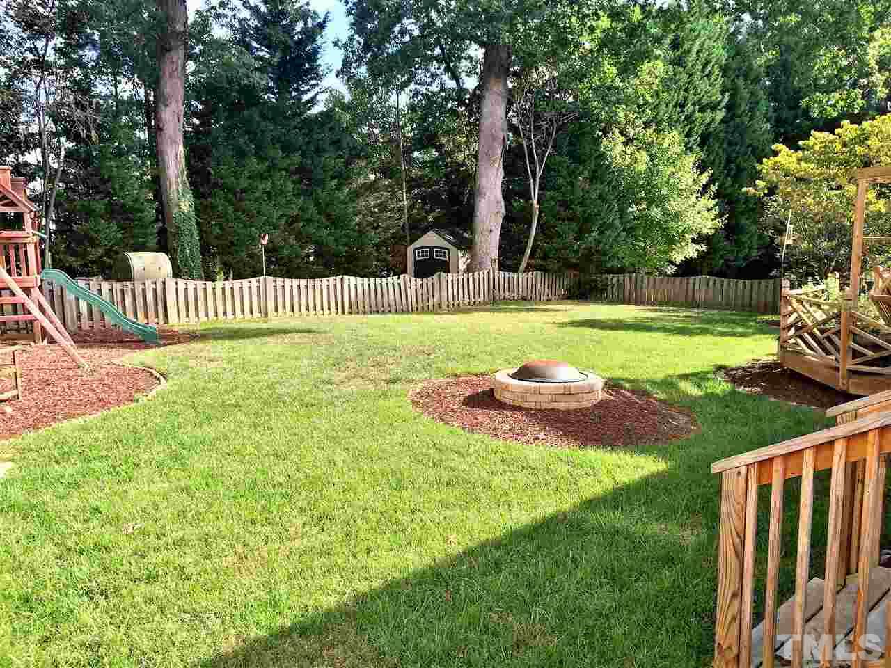 3344 Harden Road Raleigh, NC 27607 - Photo 3 of 25 a view of a chair and table with wooden fence