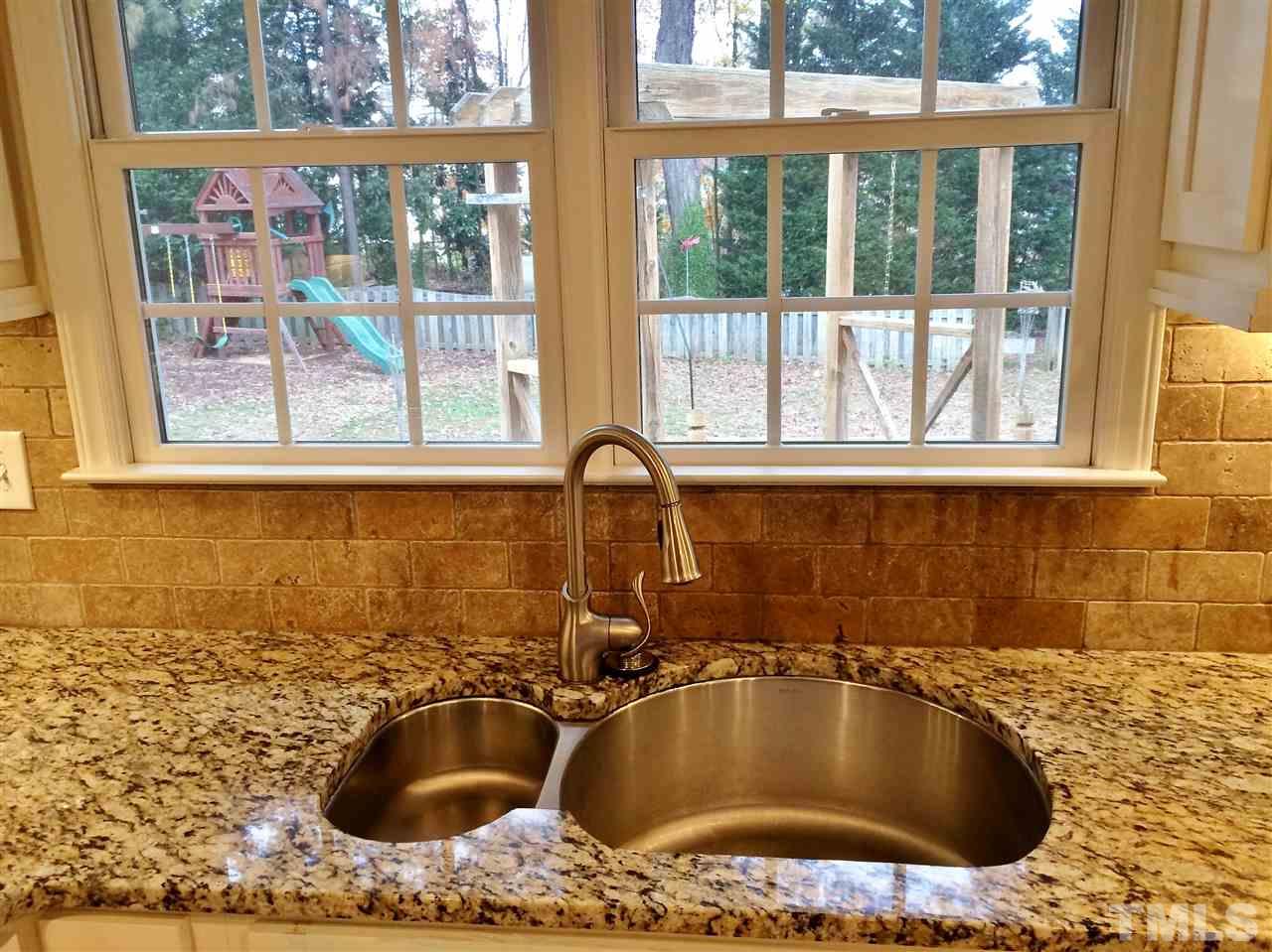 3344 Harden Road Raleigh, NC 27607 - Photo 8 of 25 a bathroom with a granite countertop sink and bathtub