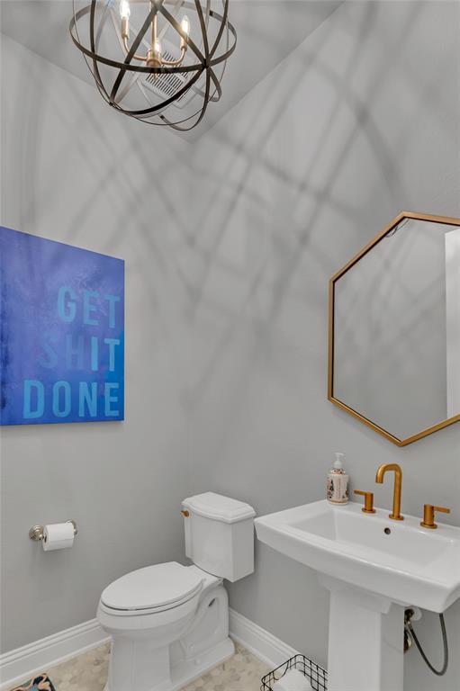 13753 Green Elm Road Fort Worth, TX 76008 - Photo 23 of 38 a bathroom with a sink mirror and toilet