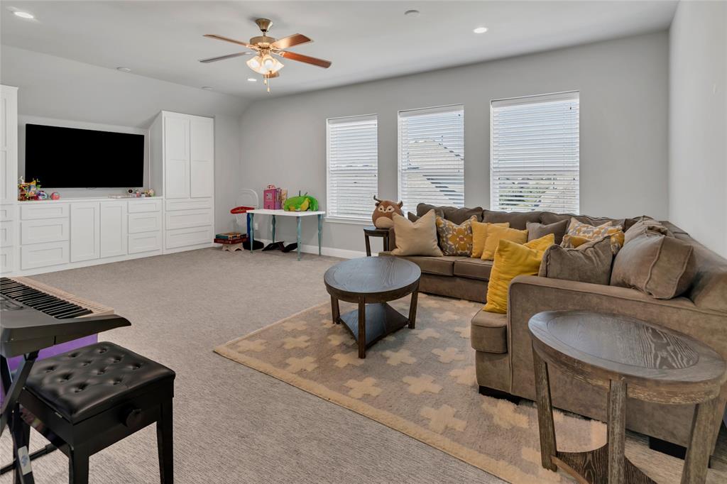 13753 Green Elm Road Fort Worth, TX 76008 - Photo 26 of 38 a living room with furniture a flat screen tv and a window