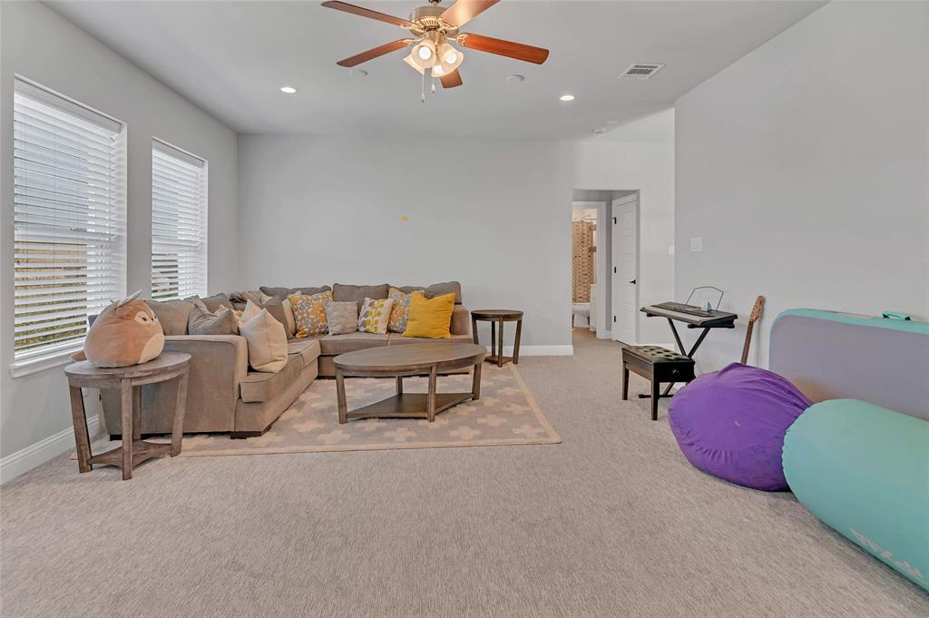 13753 Green Elm Road Fort Worth, TX 76008 - Photo 27 of 38 a living room with furniture and white walls