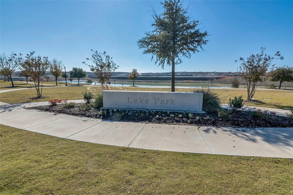 13753 Green Elm Road Fort Worth, TX 76008 - Photo 36 of 38 a view of a swimming pool with a lake view