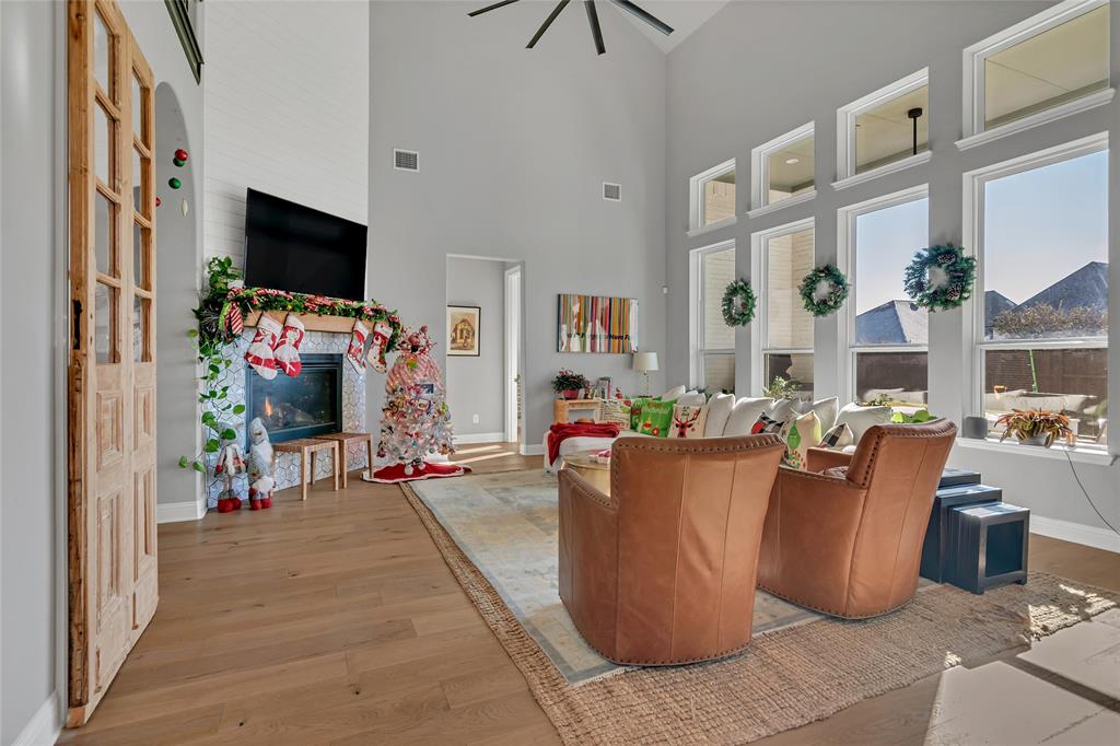 13753 Green Elm Road Fort Worth, TX 76008 - Photo 9 of 38 a living room with furniture a flat screen tv and a window