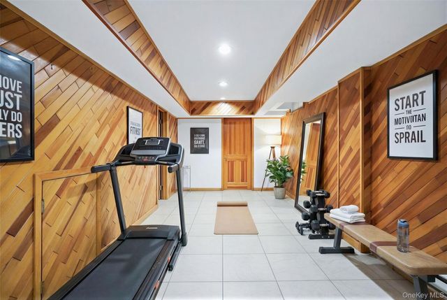 a lobby with furniture and a rug