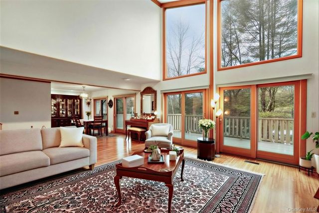 a living room with furniture and a rug