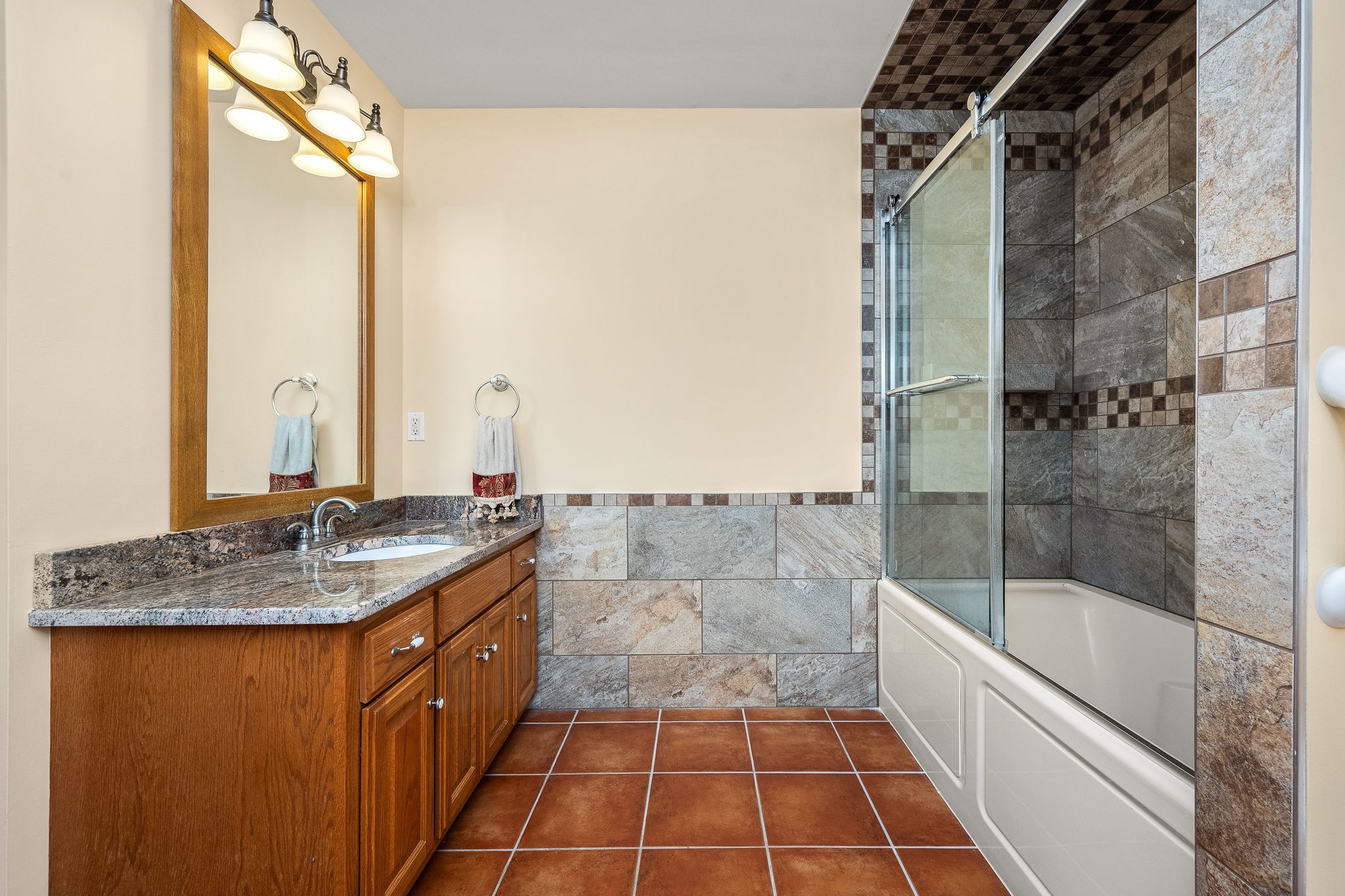 745 Union Ridge Road Wartrace, TN 37183 - Photo 25 of 78 a bathroom with a granite countertop sink a mirror and shower