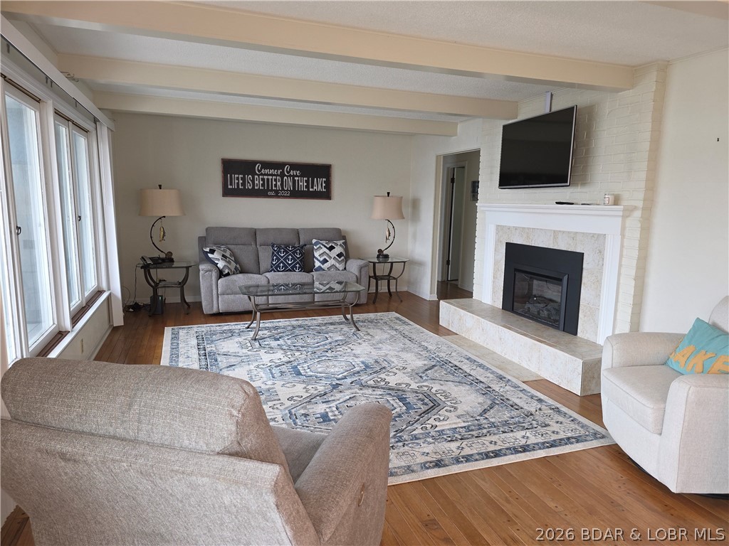 336 Boot Circle Camdenton, MO 65020 - Photo 11 of 48 Living room, New Electric Fireplace, bank of windo
