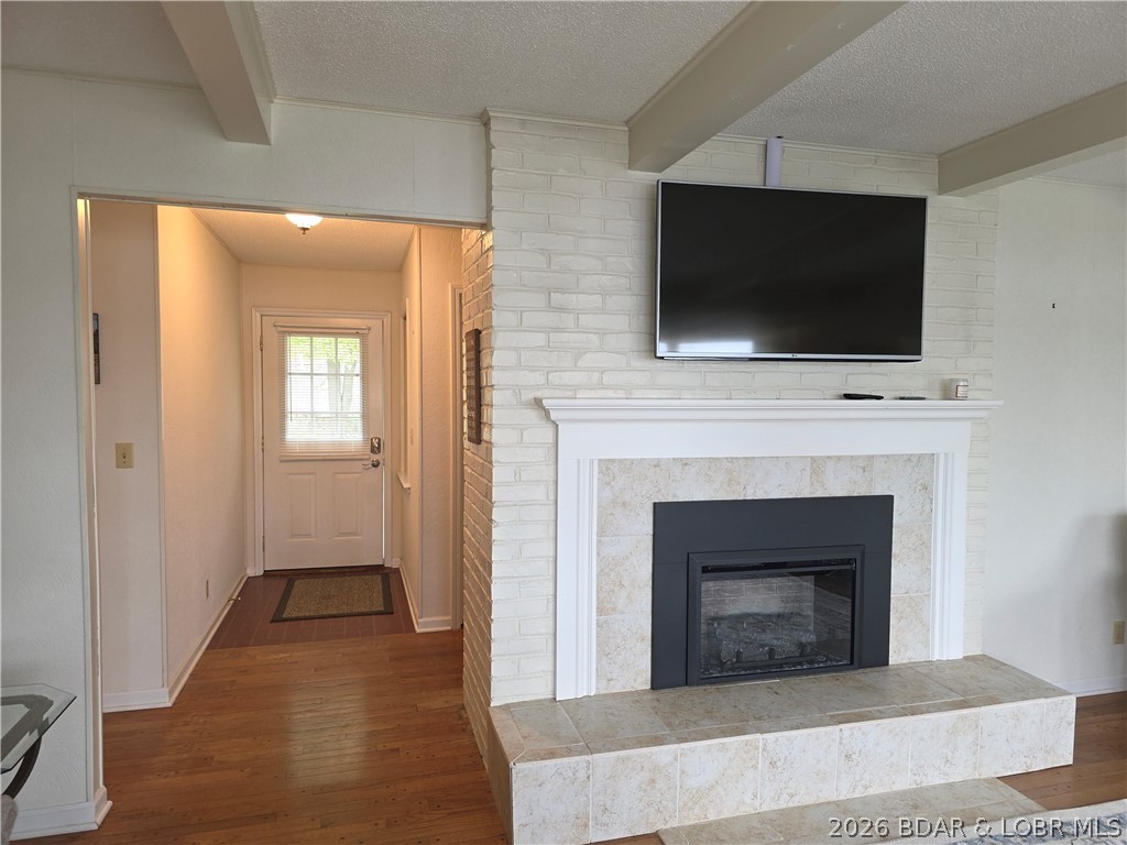 336 Boot Circle Camdenton, MO 65020 - Photo 13 of 48 New Fireplace, entry door pictured on left