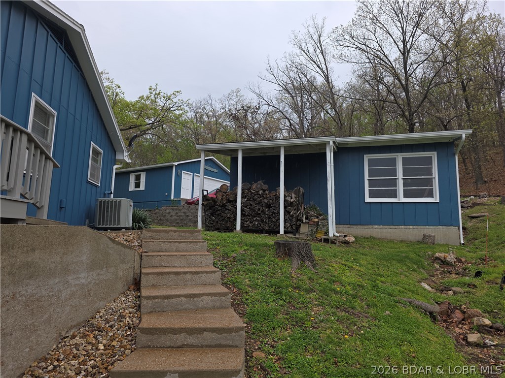 336 Boot Circle Camdenton, MO 65020 - Photo 41 of 48 side stairs from dock to upper level & front of ho