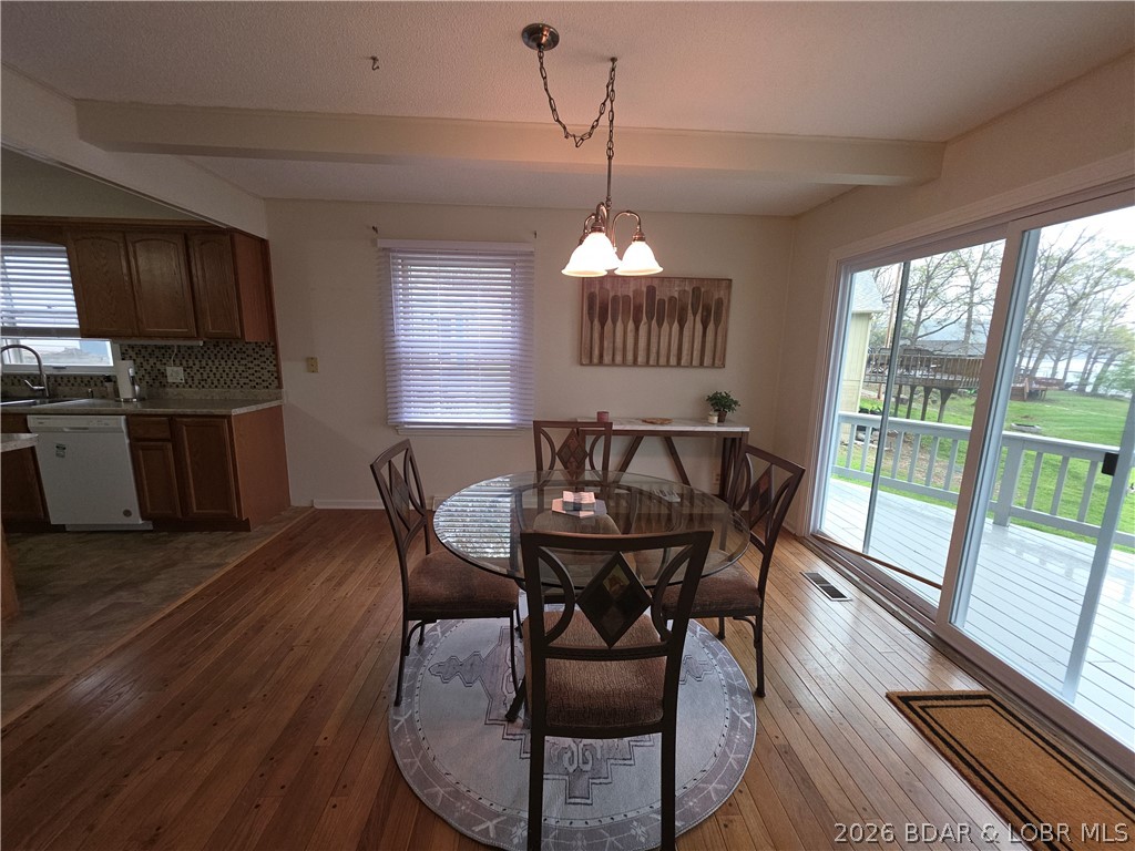336 Boot Circle Camdenton, MO 65020 - Photo 9 of 48 Dining room, new slider to deck and beautiful hard