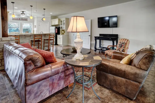 a living room with furniture fireplace and a flat screen tv