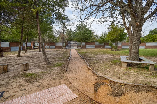 a view of a yard with tree s