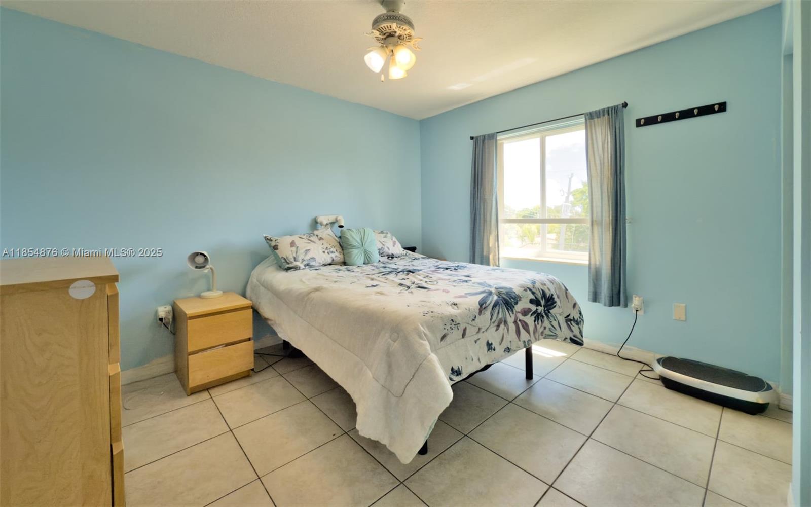 3201 West Flagler Street, Unit 209 Miami, FL 33135 - Photo 12 of 13 a bedroom with a bed and a window