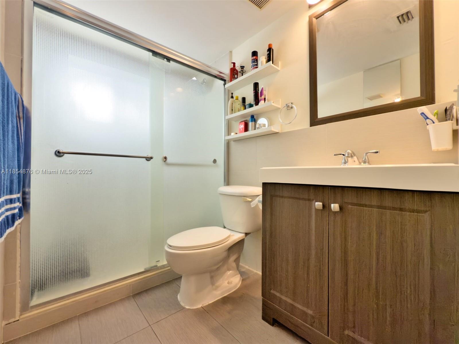 3201 West Flagler Street, Unit 209 Miami, FL 33135 - Photo 13 of 13 a bathroom with a sink toilet and shower