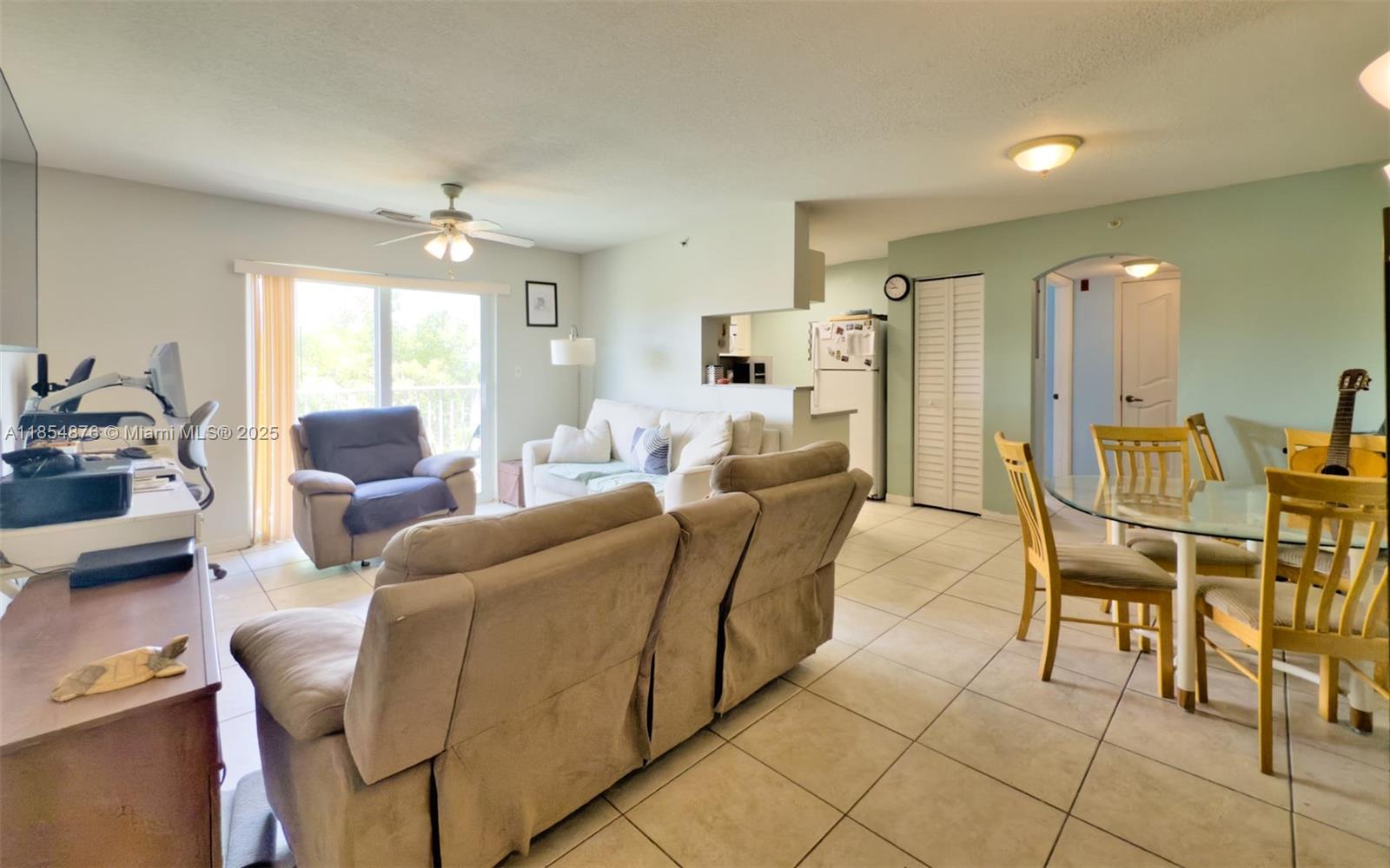 3201 West Flagler Street, Unit 209 Miami, FL 33135 - Photo 3 of 13 a living room with furniture and a large window