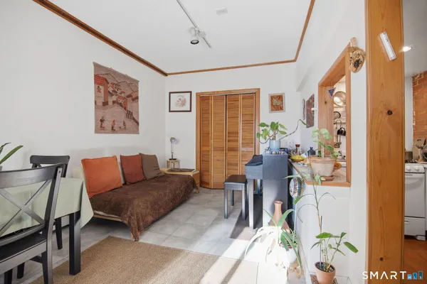 a living room with furniture and a window