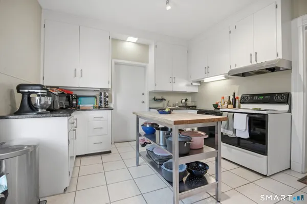 a kitchen with cabinets and appliances