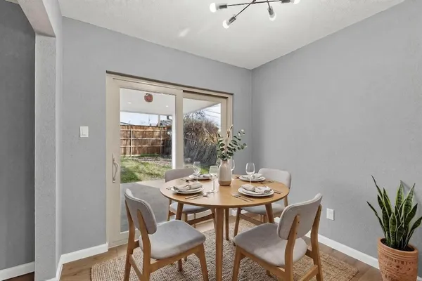 a view of a dining room with furniture window and outside view