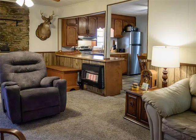 a view of a two chairs and a table in a room