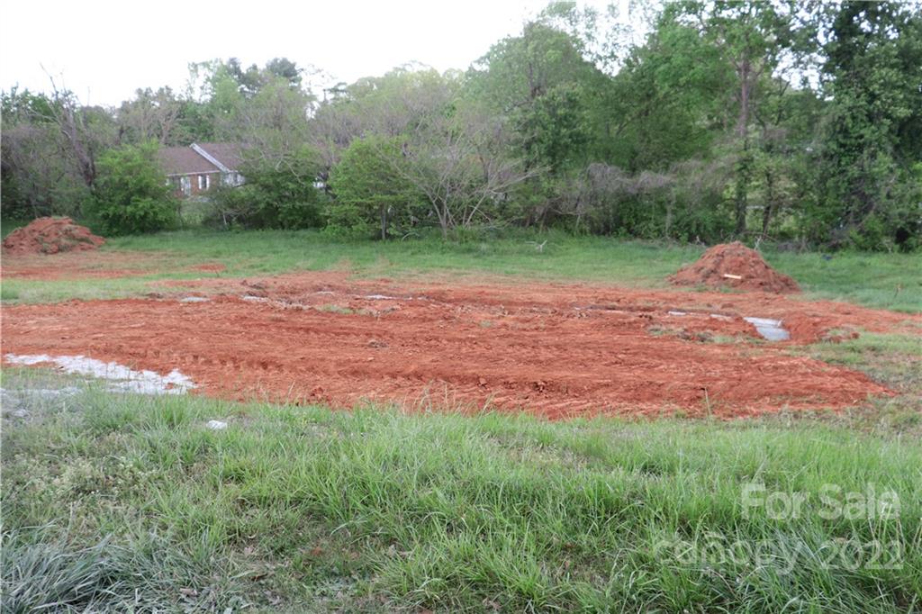 92 24th Street Northwest Hickory, NC 28601 - Photo 1 of 10 a view of a field of grass and trees