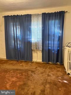7837 Provident Street Philadelphia, PA 19150 - Photo 8 of 16 Bright and airy room with blue curtains.