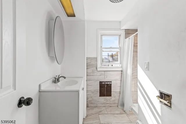a view of a hallway with washer and dryer