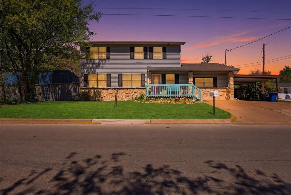 500 West Rucker Street Granbury, TX 76048 - Photo 1 of 35 a front view of a house with a yard
