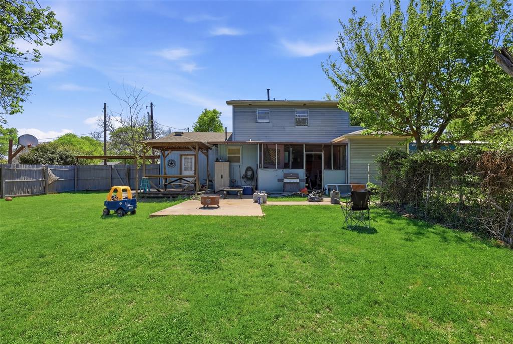 500 West Rucker Street Granbury, TX 76048 - Photo 23 of 35 a view of a house with sitting area and swimming pool