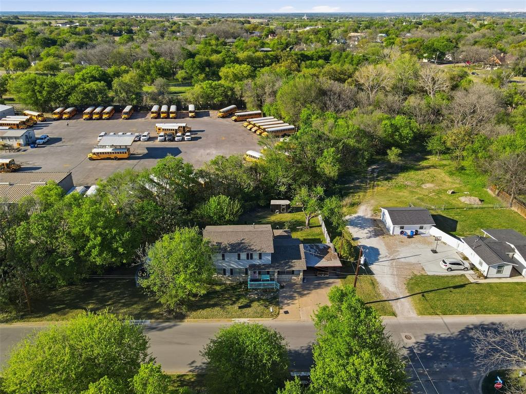 500 West Rucker Street Granbury, TX 76048 - Photo 30 of 35 an aerial view of a house with garden space and street view