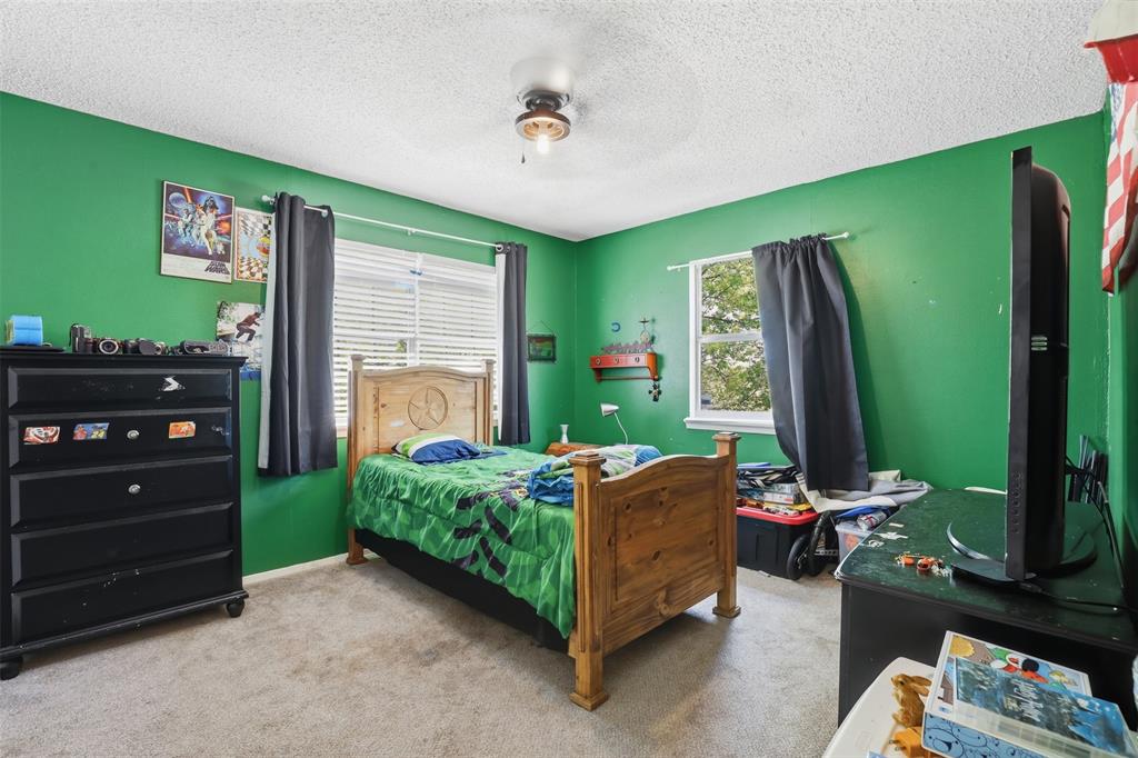 500 West Rucker Street Granbury, TX 76048 - Photo 32 of 35 a room with furniture and a window