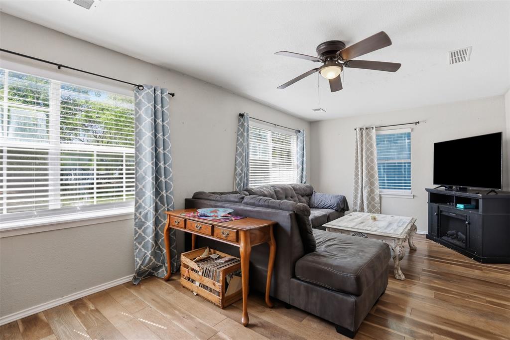 500 West Rucker Street Granbury, TX 76048 - Photo 8 of 35 a bedroom with furniture and a window