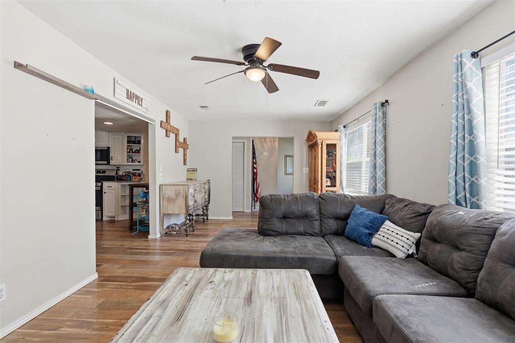 500 West Rucker Street Granbury, TX 76048 - Photo 9 of 35 a living room with furniture and a large window