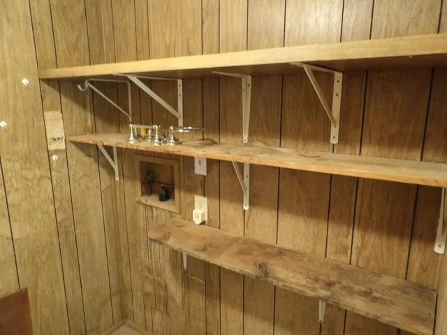 a room with a bed and a window