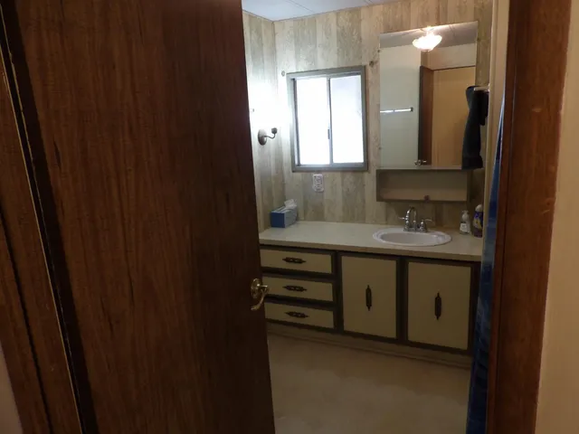 a white toilet sitting next to a shower