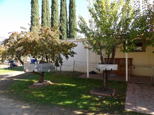 a view of a lake with couches and wooden floor