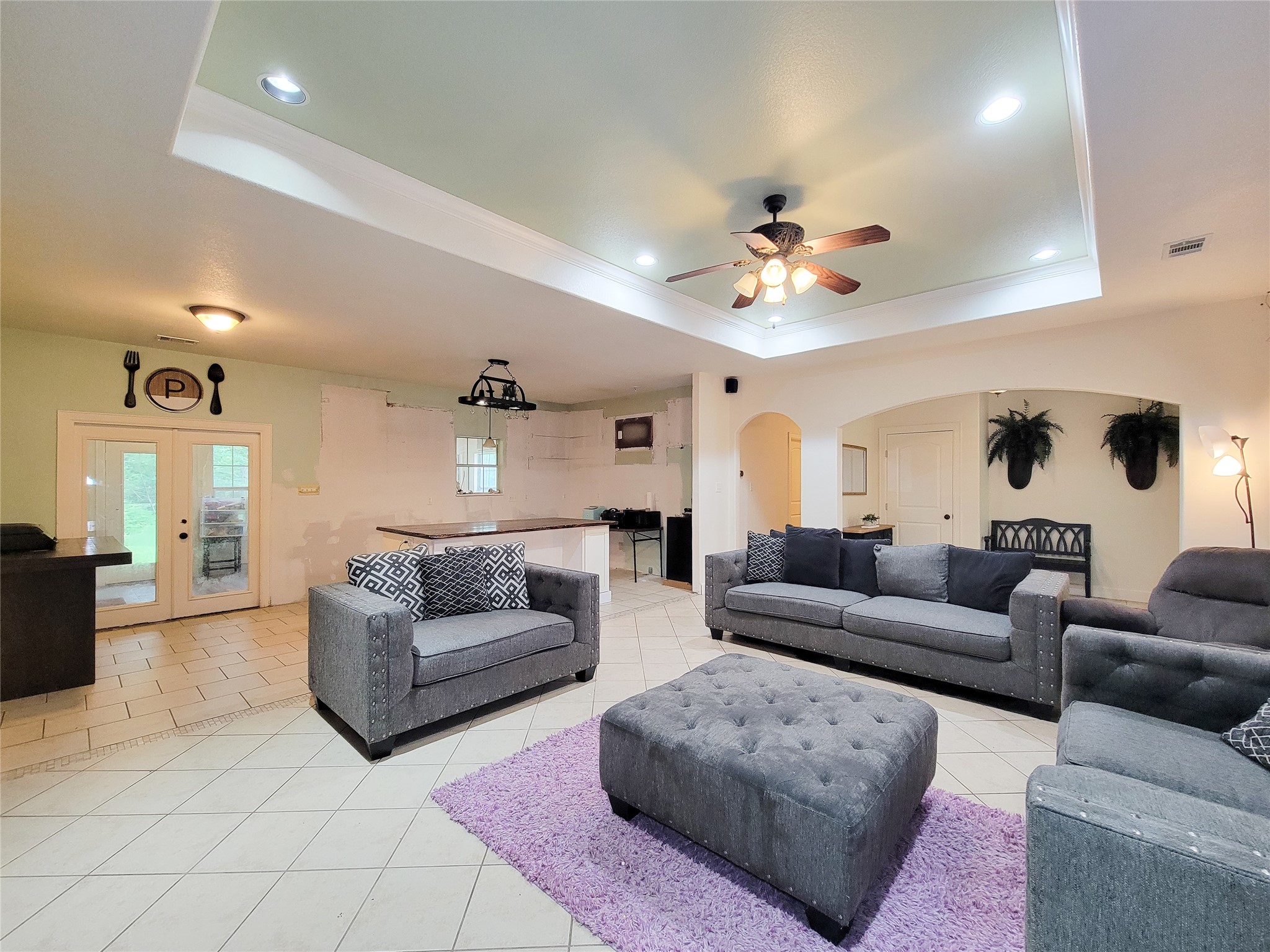 2011 Old Ox Road Spring, TX 77386 - Photo 19 of 38 a living room with furniture a fireplace and a chandelier