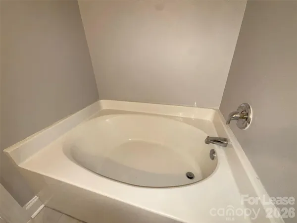 a bathroom with a white bath tub