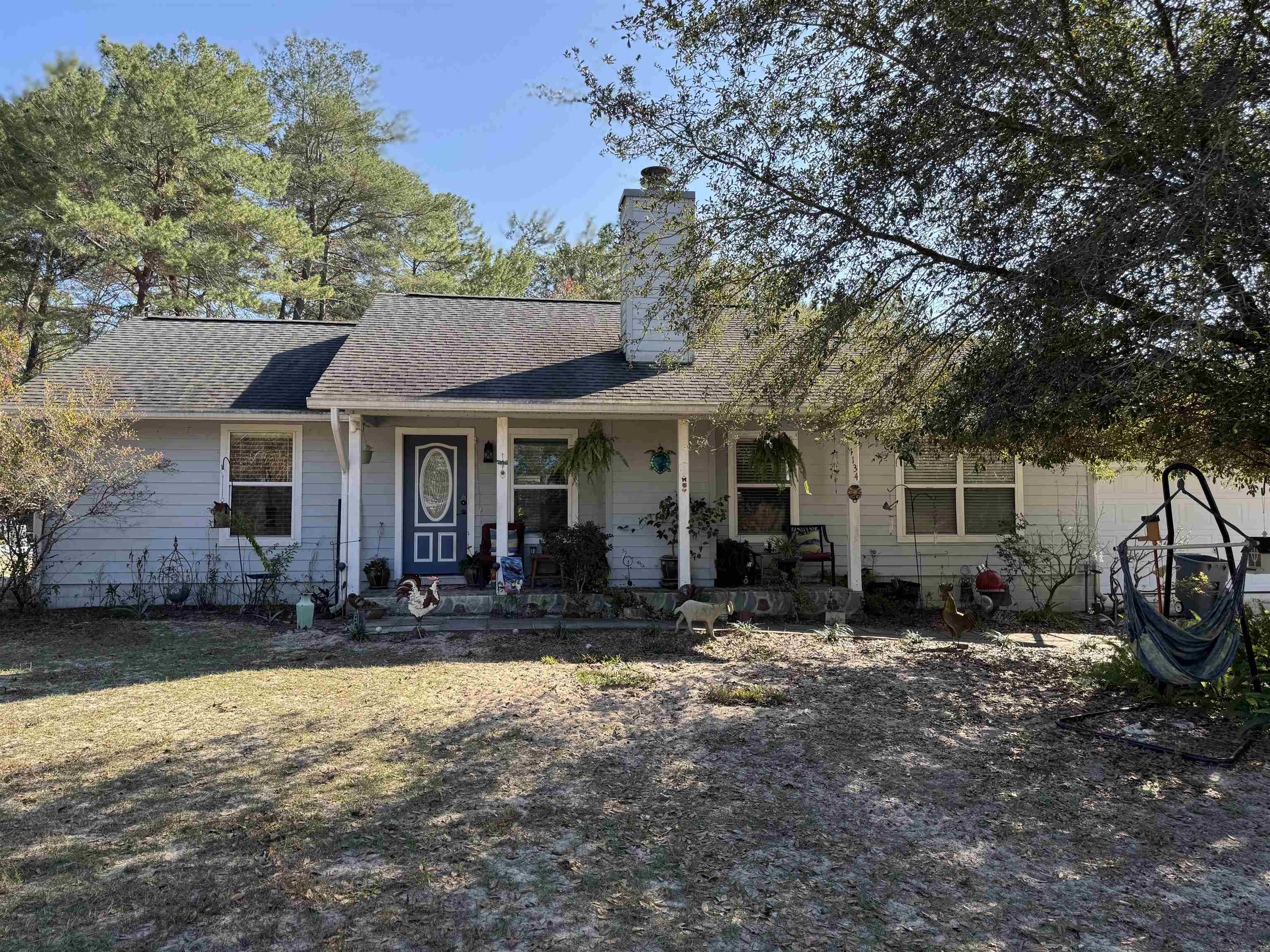 1134 Coral Farms Road Florahome, FL 32140 - Photo 2 of 33 a front view of a house with a garden