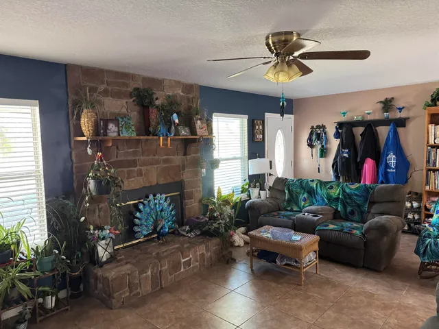 a living room with furniture and a fireplace