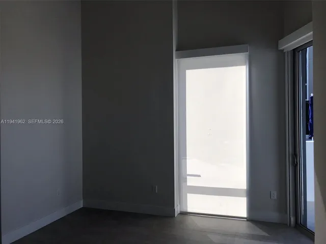 a view of gallery with wooden floor