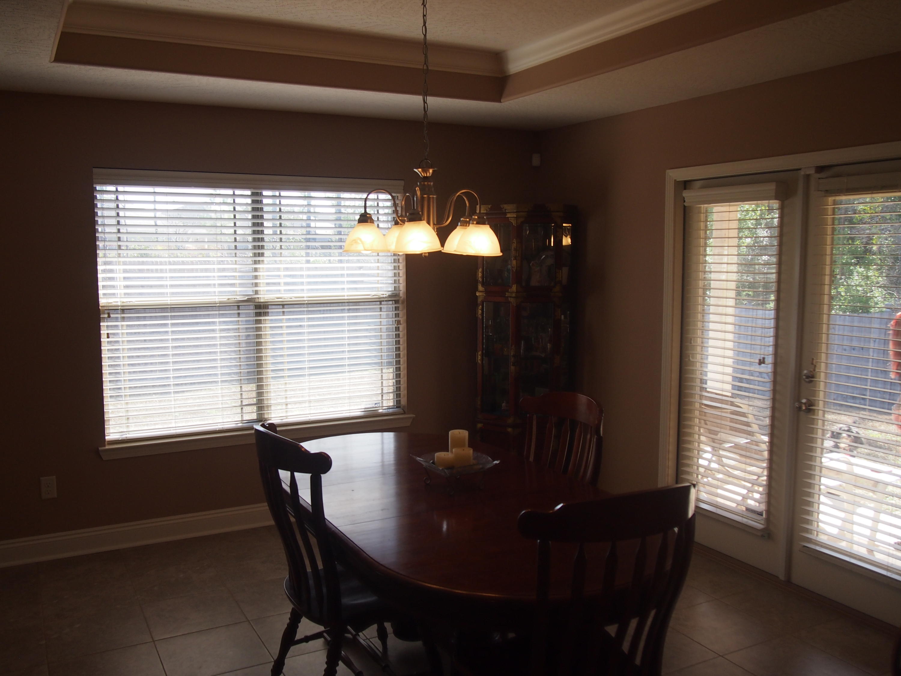 9273 Sundance Court Navarre, FL 32566 - Photo 15 of 33 a view of a dining room with furniture and window